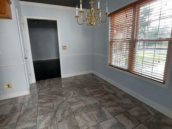 Dinning room adjacent to the kitchen. Doorway leads to the living room.