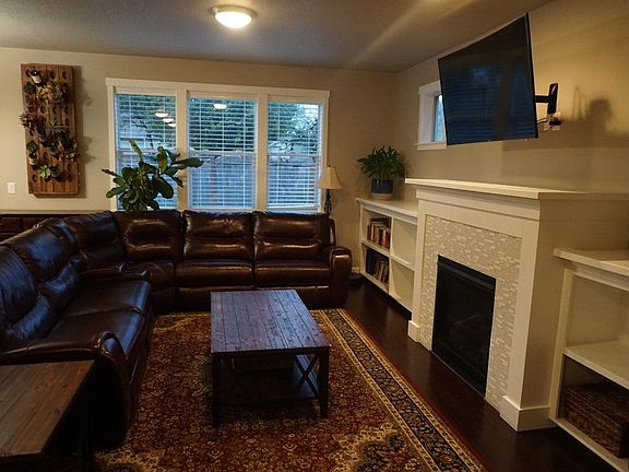 Open living room with natural gas fireplace