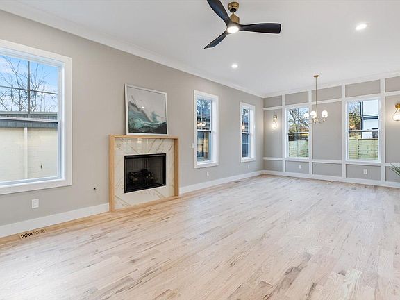 Gas Fireplace with Oak mantel and TV hookups above