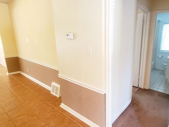 Bedrooms to the right with bathroom. Kitchen, dining and family room to the left.