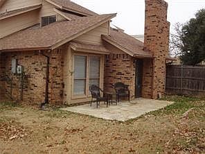 Back of house with a patio area
