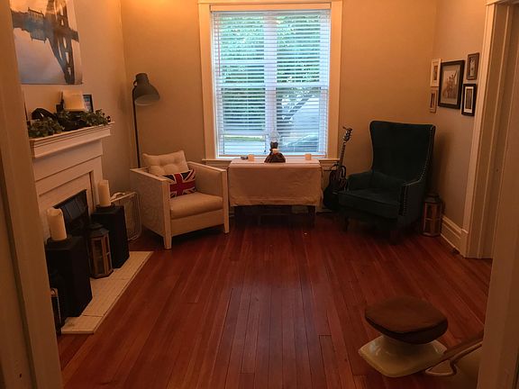 Original hardwood floors & great light! This room could be an office or living area.