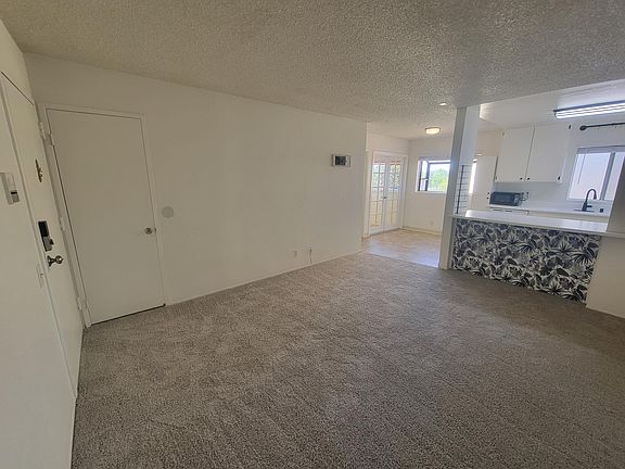 Spacious storage closet located next to front door.