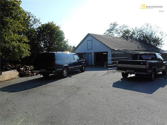 2nd outbuilding has concrete floor and block walls. Can fit 4 cars.  Back in the day it used to be the "dairy barn".