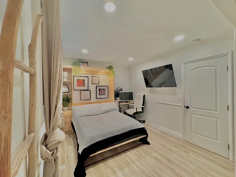 Built-in Murfey Bed with storage cabinetry. Simply remove pillows and fold base leg. Push bed up to clear the entire floor space for home office use, playroom, use, etc.. great for guests!