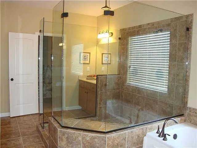 Huge frameless shower with 2 heads