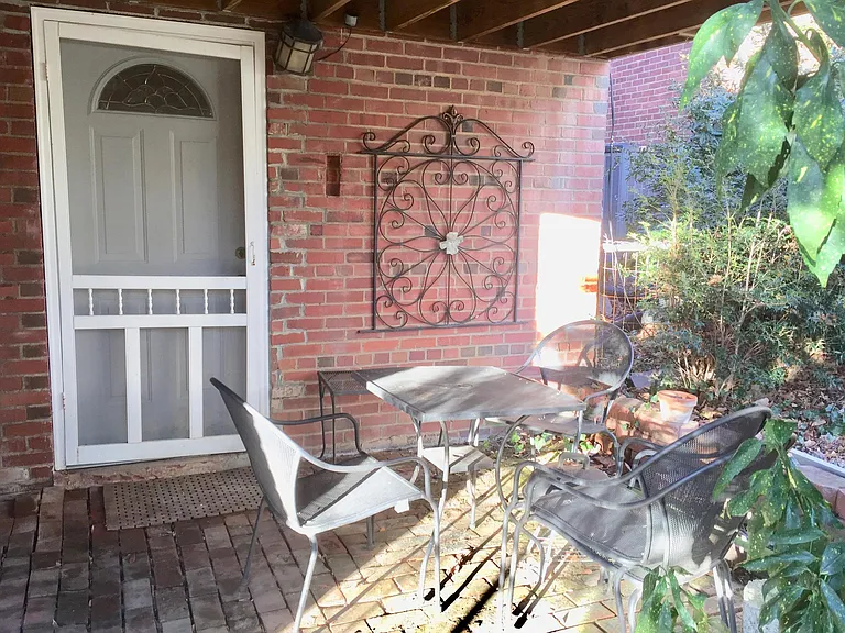 Lower level entrance to in-law suite includes private patio.