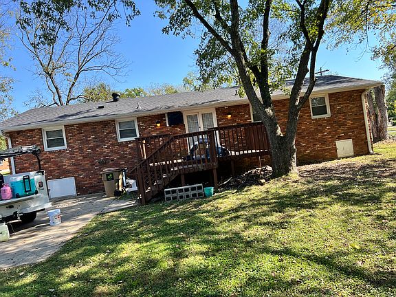 Nice large deck overlooking large backyard.