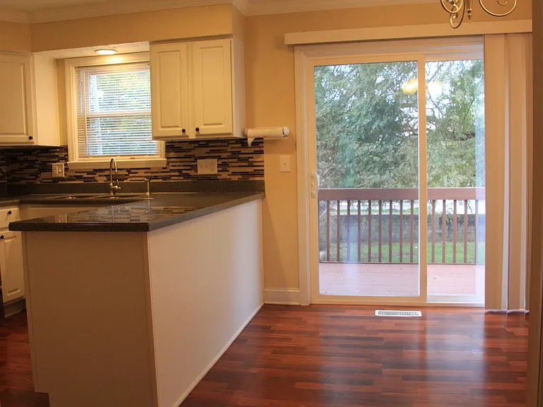 Kitchen with attachd walk out deck