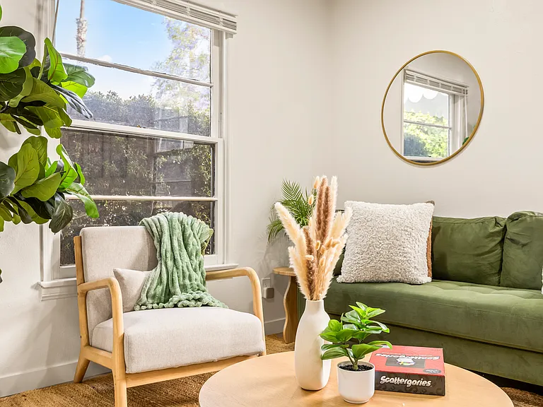 Open living room with smart TV, ideal for relaxing after enjoying nearby beaches, cafes, and attractions.
