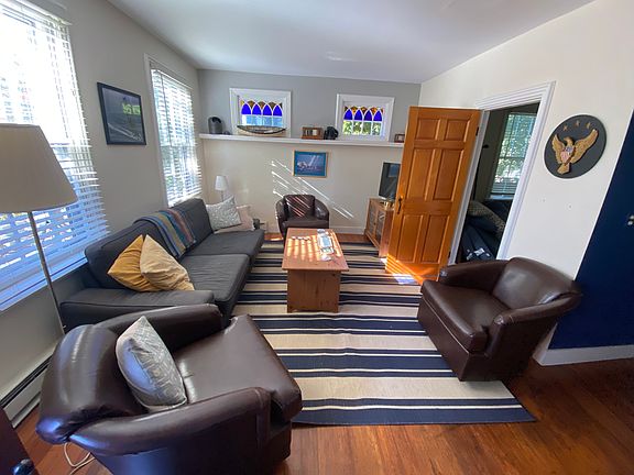 Living room, showing entrance to 3rd bedroom, laundry room and full bath.