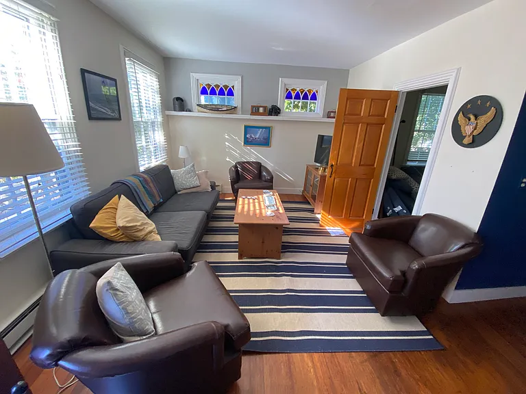 Living room, showing entrance to 3rd bedroom, laundry room and full bath.