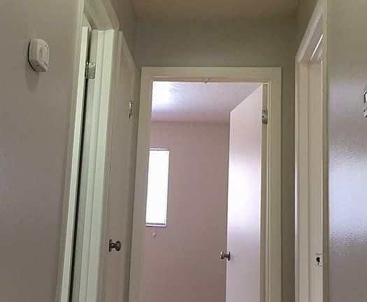 Hallway leading to bedrooms and bathroom
