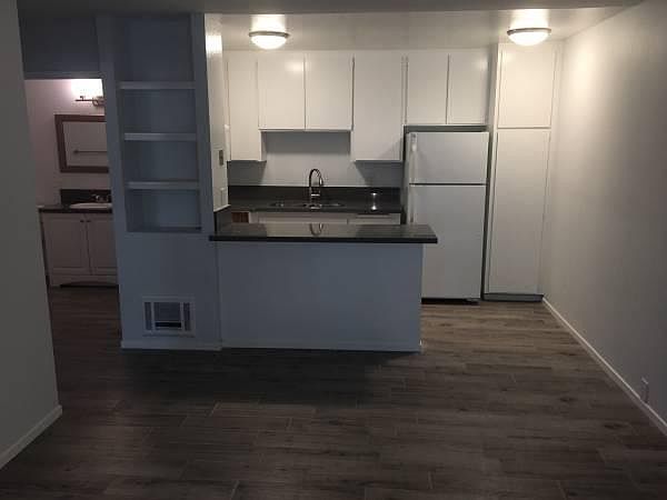 Looking from living room towards kitchen. Kitchen is fully r