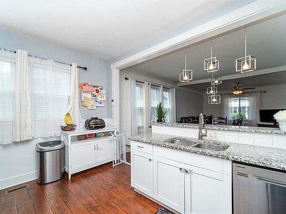Beautiful Granite and floors all  through out downstairs 