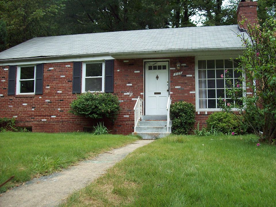 Front of the house. The two, open-car parking is to the right side