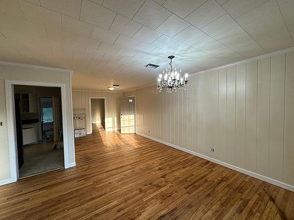 Living Room with view towards the kitchen and back door