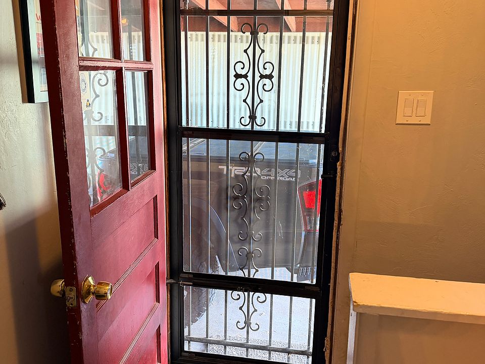 Side entrance from the carport. Owner comes in through front door.