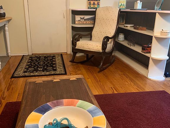 Living area; small white door in back is storage area