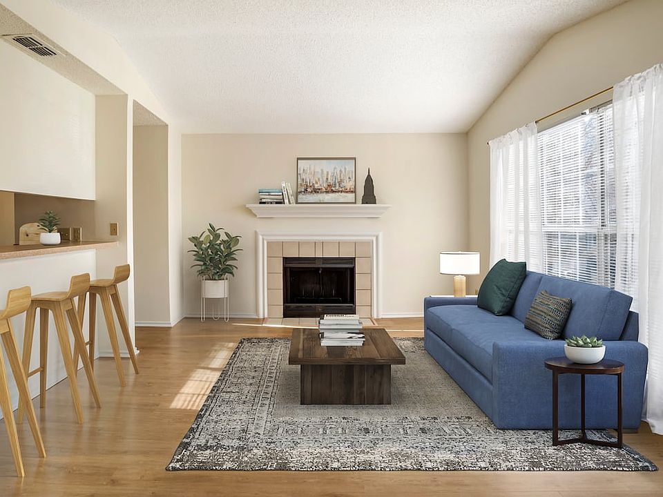 Renovated Package I kitchen and living area with hard surface flooring in common areas