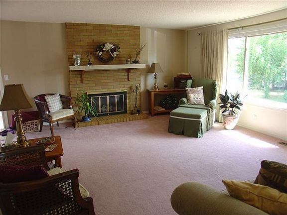 Large formal living room with gas fireplace.