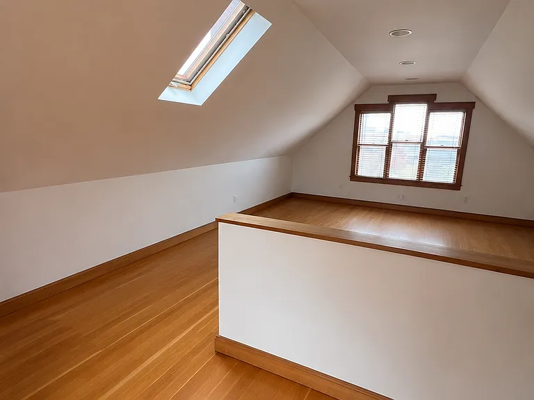 Upstairs bedroom or living/workspace