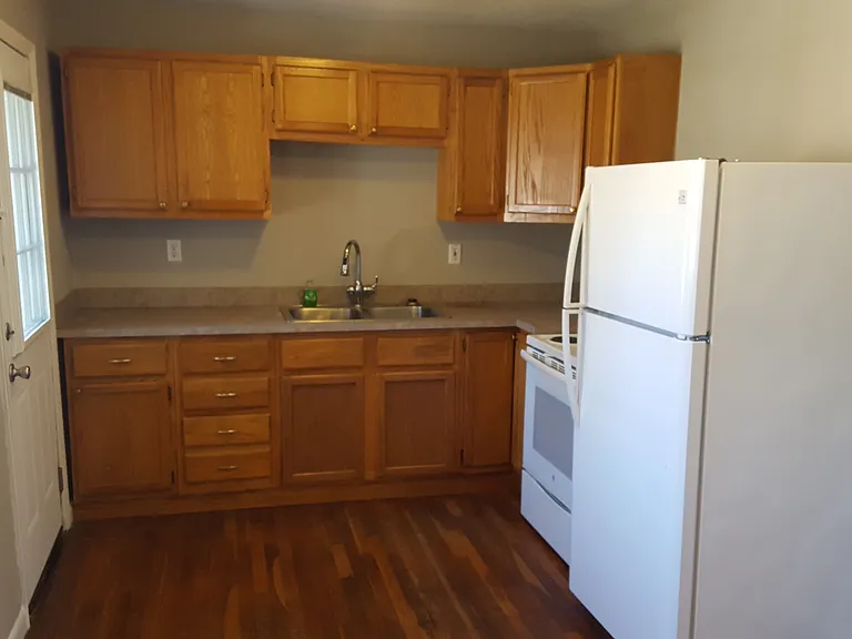 kitchen with stove and refrigerator
