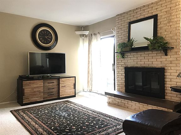 Living room w/fireplace, slider to deck