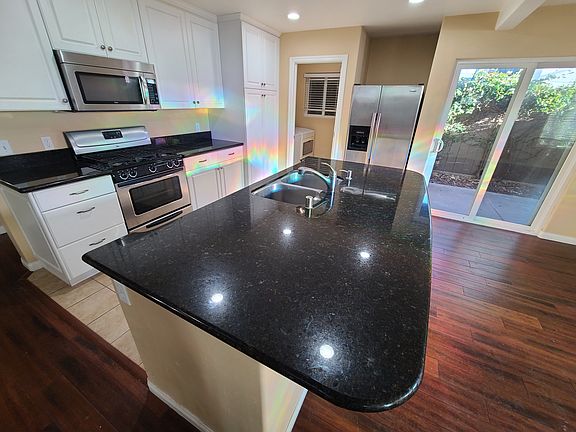 Dishwasher is under the island - to the left of sink.