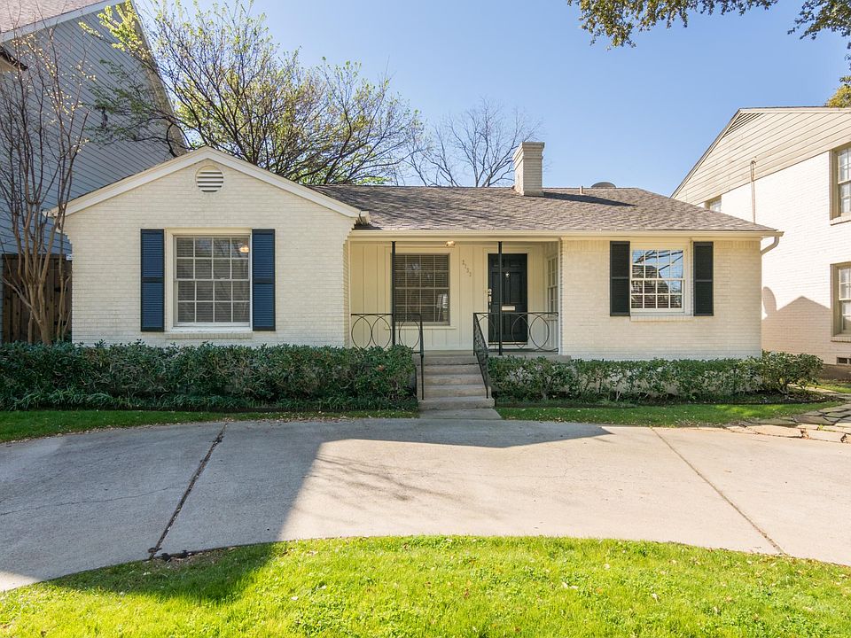 Front of the home with circular driveway providing ample front parking