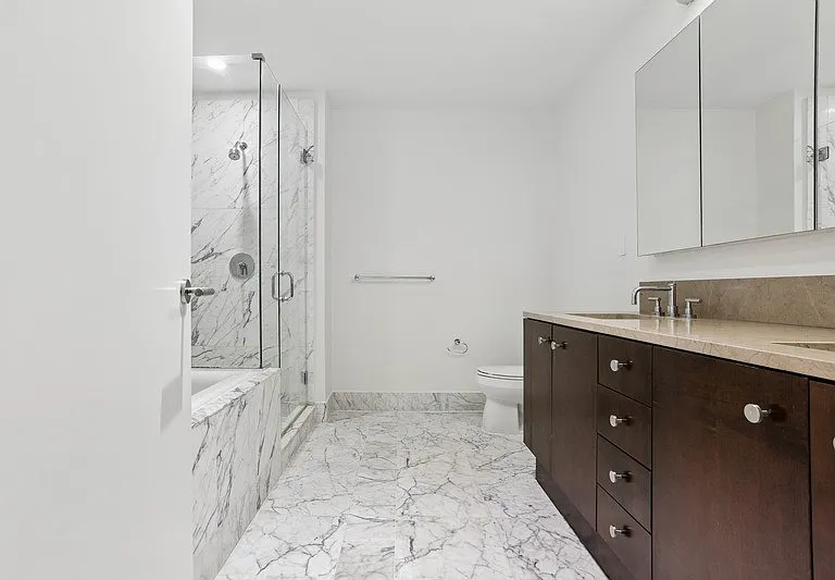 Elevate your daily routine in this stunning bathroom at Arbor. Featuring elegant marble flooring, a spacious shower, and modern fixtures, it's a sanctuary of comfort and style. Schedule your tour today to envision your new home!