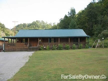 Front Exterior
						:
						Wood siding with metal roof.
