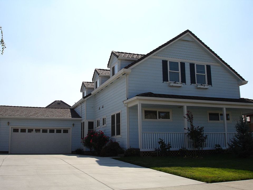 Front elevation. Note the 61' x 24' driveway w/RV Hookups available.