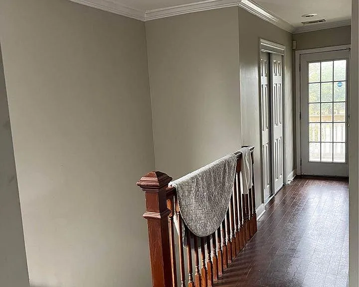 Upstairs landing with French doors opening to the front porch.