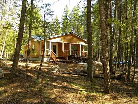 Gently sited on this 1/2 acre lot amongst the trees to have a lower impact on land