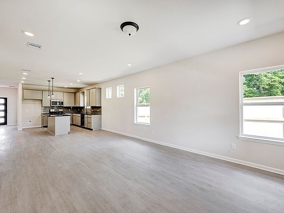 The Davenport II- Family Room into Dining Area and Kitchen