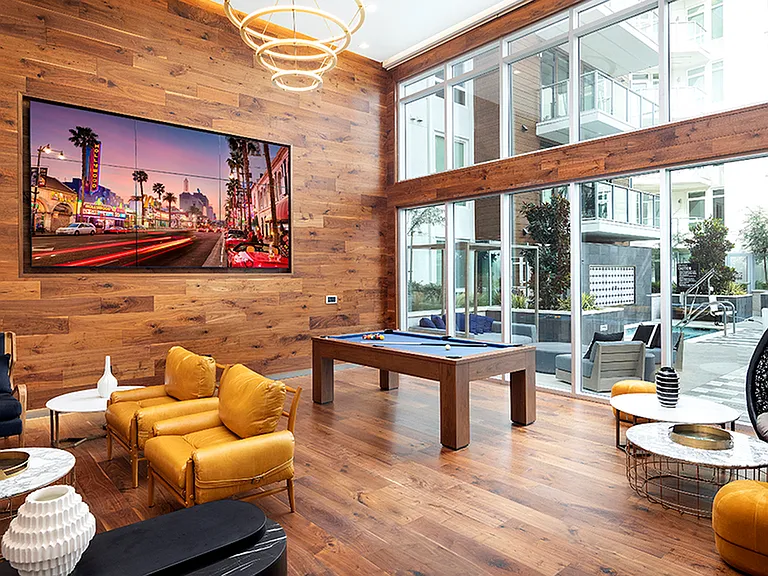 Stunning clubroom with billiards and lounge areas with access to outdoor terrace