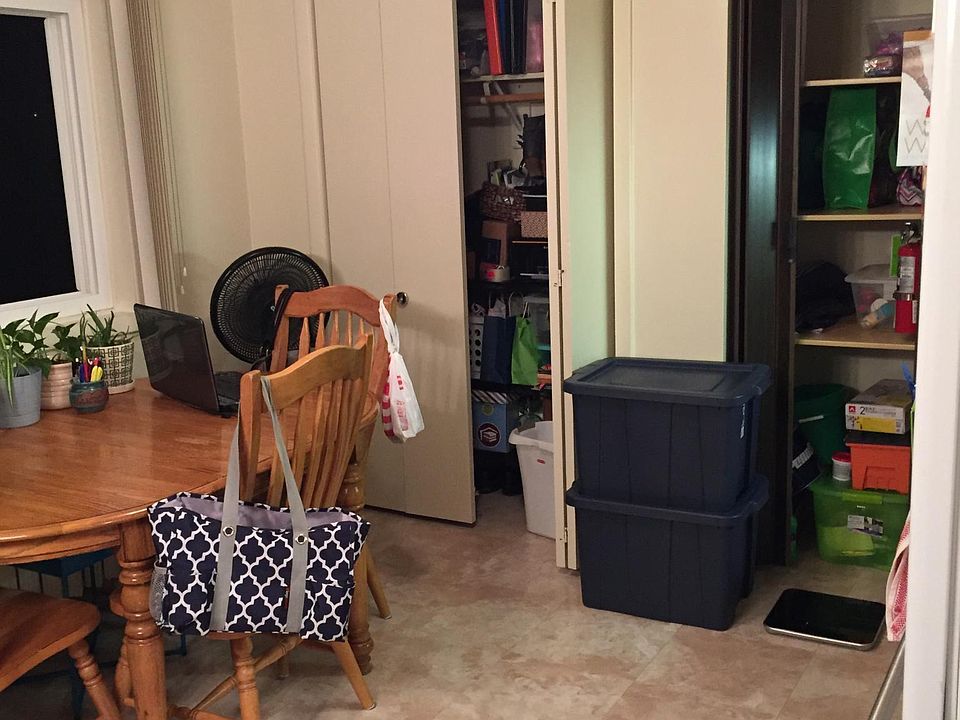 Kitchen with closet on left and pantry on right.