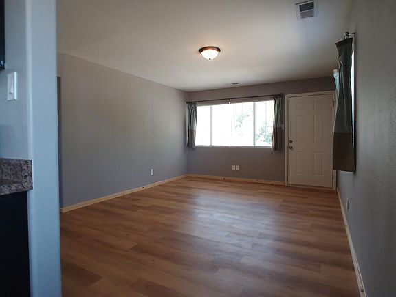 Living room and front door taken from kitchen.