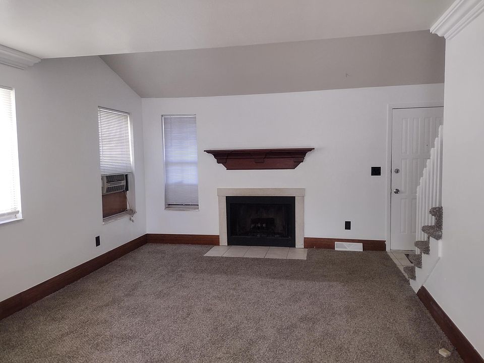 Living room with working fireplace. Whole house swamp cooler