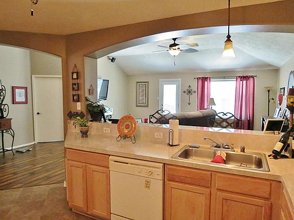 The open floor plan allows the chef of the family to participate in all of the family activities.