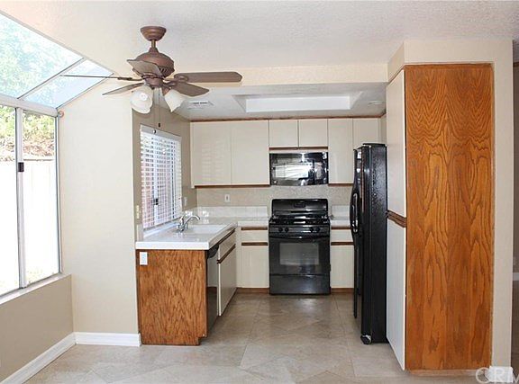 Spacious kitchen opens to breakfast nook and family room.