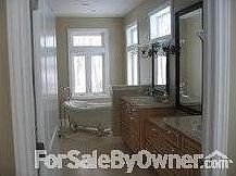 Master Bath
						:
						The master bath has a claw foot tub and glass enclosed tile shower.