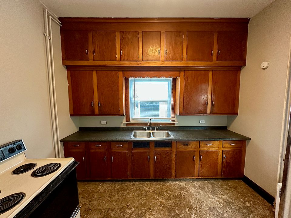 Copious kitchen storage space in beautiful hardwood cabinets.