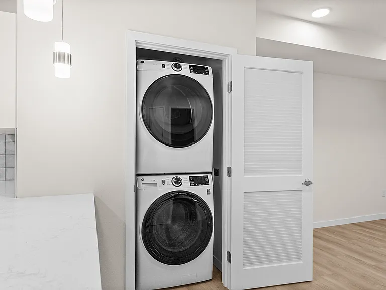 Convenient in-unit stacked washer and dryer tucked neatly inside a private laundry closet. Convenient in-unit stacked washer and dryer tucked neatly inside a private laundry closet.