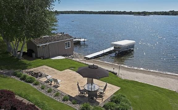 Enjoy the private finished lakeside boat house, perfect to store all of your lakeside fun!
