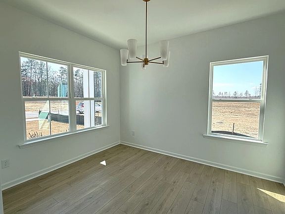 Dining Room featuring the AW Collection R Serene - A peaceful space for slow meals and soft light.