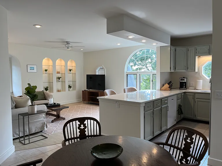 High ceilings and natural light make this open concept living area comfortable and bright.