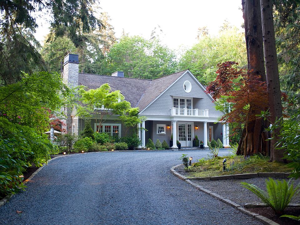 Gravel driveway leads to main house & parking