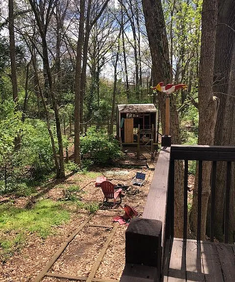 view from deck to firepit, chicken coop. Large fully fenced-in yard